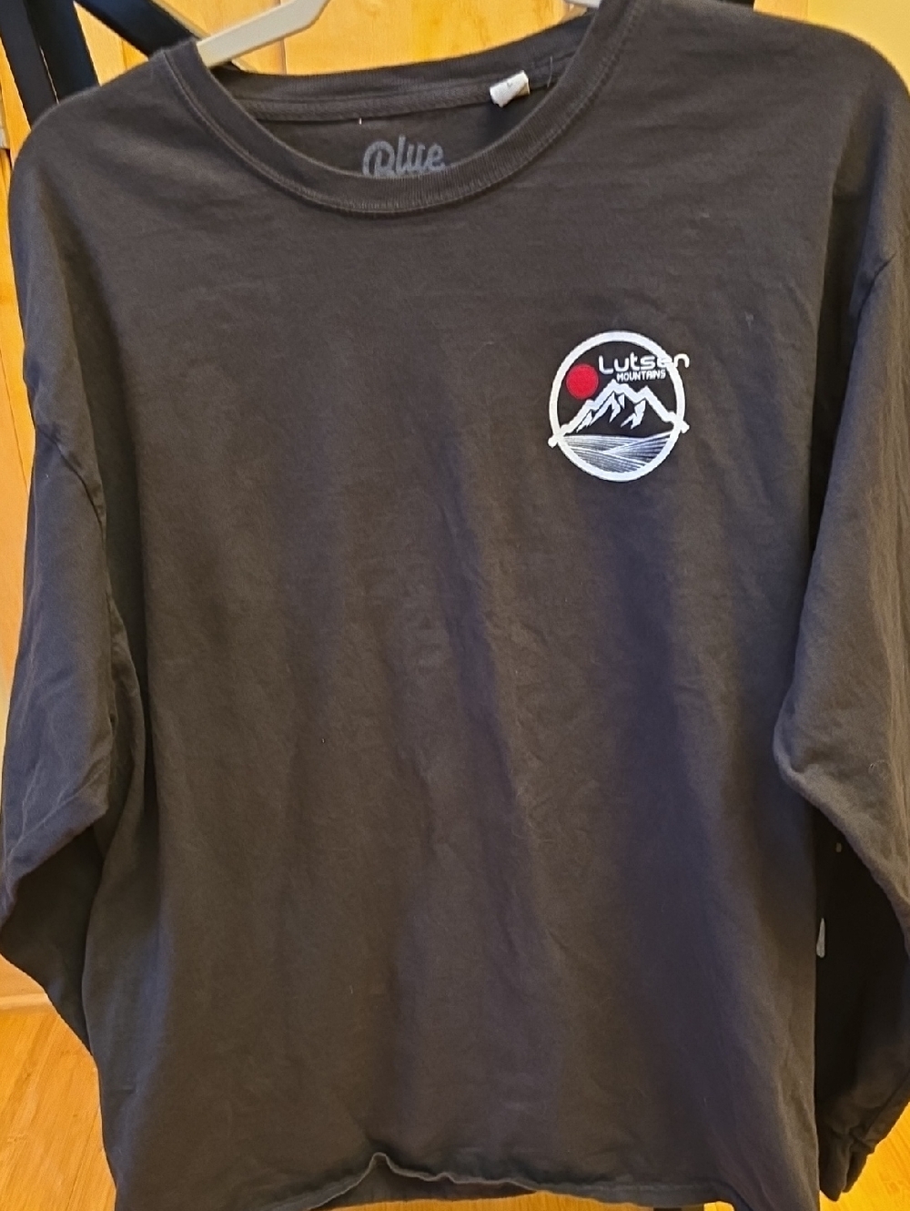Blue 84 Black Tee with White Mountain Logo and Red Sun